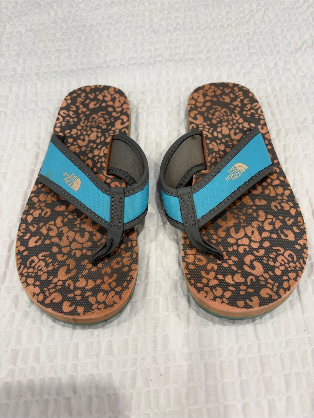 The North Face Kids Teal Strap Brown Patterned Flip Flops